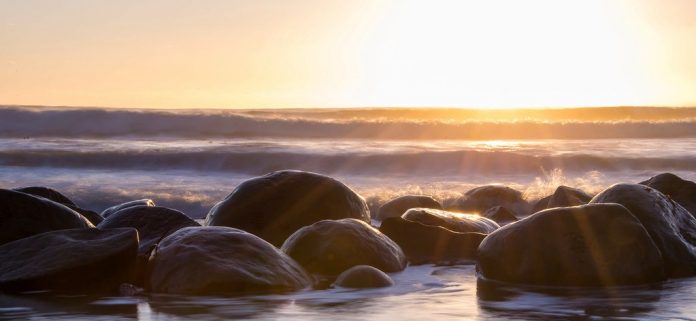 At low tide, the bowling balls are exposed to the air and can be seen from a distance.