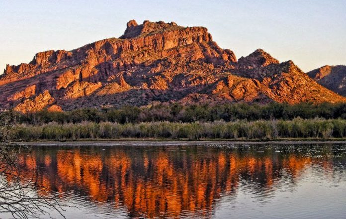 The best time to visit the Red Mountain Arizona formation is in the morning or middle of the day when it becomes shadowed and more interesting.
