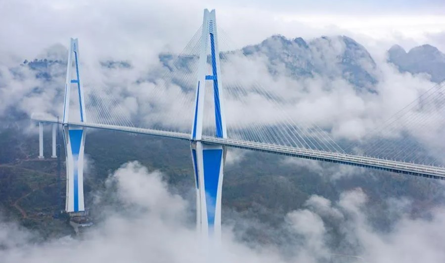 With a height of 1,089 feet, the bridge is the third tallest in the world. Construction began on April 29, 2016, and the main bridge closing project was fully connected and opened to traffic on December 30, 2019.
