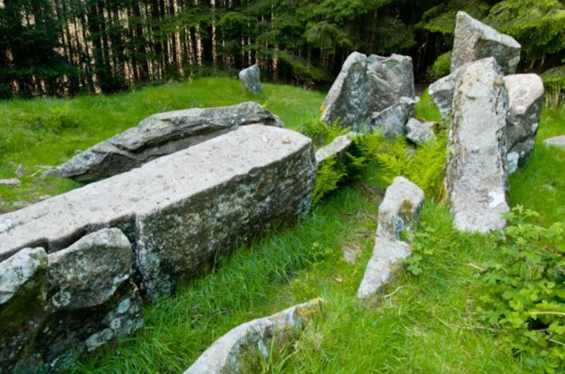 Giant's Grave Arran - These cairns are believed to date back to the Neolithic period, around 4,000 to 2,500 BCE. Located on a ridge 120 meters above the sea, they stand within 40 meters of each other in a clearing in a forest overlooking Whiting Bay.