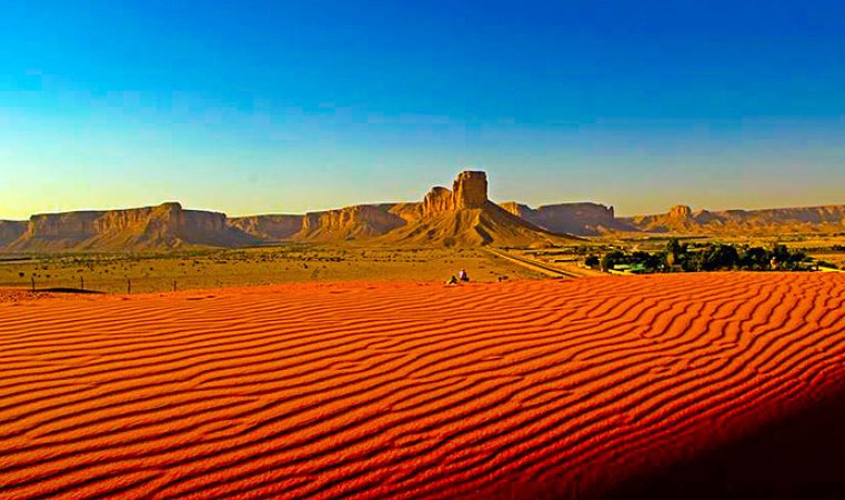 There is an area of Red Sand (or Red Sand Dunes) 80 km from Northeastern Riyadh, Saudi Arabia. Dirab is a nearby area where the dunes are located.
