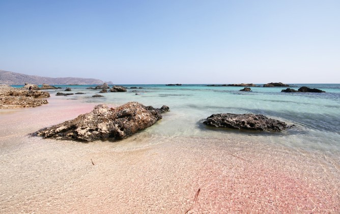 The pink sand, crystal clear waters, and natural beauty are hallmarks of this stunning destination.