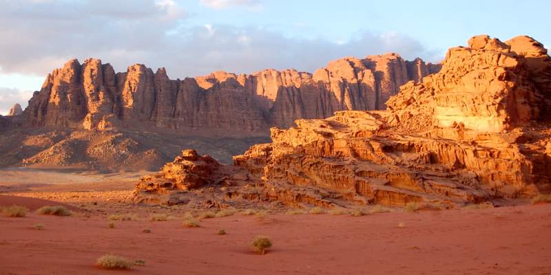 This mountain appears to be many things because of its shape. An ocean of sand, a procession of figures, a bulwark for a great ship, a collection of lopsided pillars.