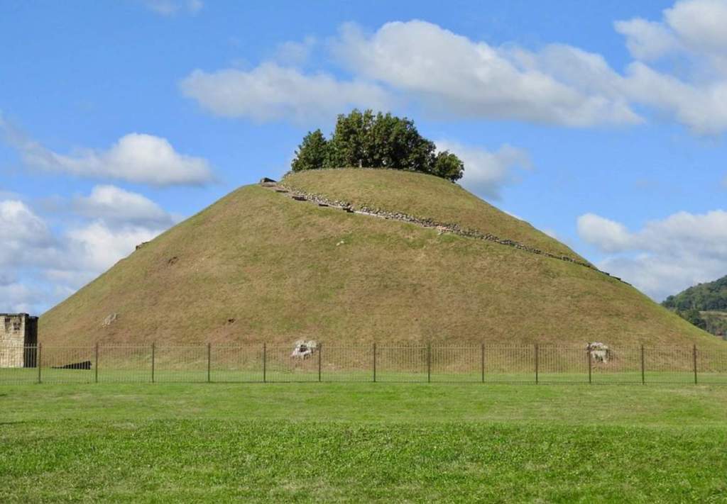 Grave Creek Mound was originally 65 feet, 19.5 meters tall, with an outer circumference of 910 feet, 273 meters.