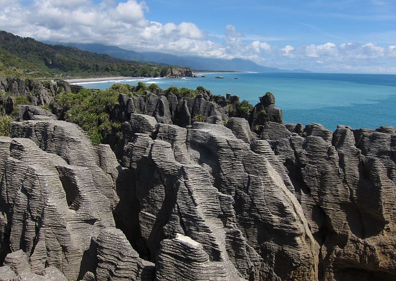Paparoa National Park Located on the west side of the South Island, the park incorporates the Paporoa Mountain Range and runs down the layer of rocks on the coast.